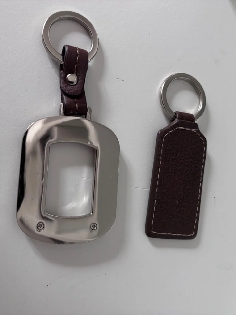 2 leather Tignanello keychains/bag charms